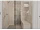 Modern glass shower features stylish tile work, sleek fixtures, and a built-in bench at 855 Peachtree Ne St # 1311, Atlanta, GA 30308