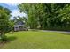 Spacious backyard featuring lush lawn and a shed at 129 2Nd Se Ave, Atlanta, GA 30317