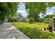 Expansive backyard with lush green lawn, deck, and mature trees offering privacy and serenity at 129 2Nd Se Ave, Atlanta, GA 30317