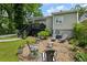 Spacious backyard with fire pit area, seating, and deck offering seamless indoor-outdoor living at 129 2Nd Se Ave, Atlanta, GA 30317