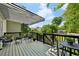 Charming covered deck features comfortable seating and a beautiful view at 129 2Nd Se Ave, Atlanta, GA 30317