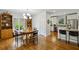 Open dining area with hardwood floors, connects seamlessly to a modern kitchen at 129 2Nd Se Ave, Atlanta, GA 30317