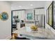 Charming kitchen featuring white cabinets, granite countertops, and stainless steel appliances at 129 2Nd Se Ave, Atlanta, GA 30317