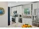 Well-equipped kitchen boasts white cabinets, stainless steel appliances, and granite countertops at 129 2Nd Se Ave, Atlanta, GA 30317