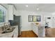 Open kitchen featuring granite countertops and stainless appliances at 129 2Nd Se Ave, Atlanta, GA 30317