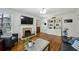 Cozy living room with hardwood floors, fireplace, built-in shelving and a warm atmosphere at 129 2Nd Se Ave, Atlanta, GA 30317