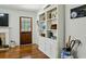 Bright living room features a fireplace, hardwood floors, and custom built-in shelving at 129 2Nd Se Ave, Atlanta, GA 30317