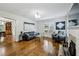 Comfortable living room with hardwood floors, fireplace, and easy access to the dining area at 129 2Nd Se Ave, Atlanta, GA 30317