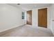 Cozy bedroom with soft carpeting and a view of the backyard at 4202 Maplewood Dr, Decatur, GA 30035