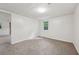 Cozy bedroom with soft carpeting and neutral paint color at 4202 Maplewood Dr, Decatur, GA 30035