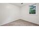 Small bedroom featuring neutral paint color and carpet at 4202 Maplewood Dr, Decatur, GA 30035