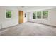 Bright living room with plush carpeting and large windows at 4202 Maplewood Dr, Decatur, GA 30035