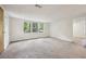Bright living room with plush carpeting and large windows at 4202 Maplewood Dr, Decatur, GA 30035