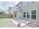 Spacious backyard with green lawn, fenced perimeter, and concrete patio at 5730 Weddington Dr, Cumming, GA 30040