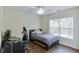 Bedroom featuring hardwood floors, natural light, a ceiling fan, and a workspace at 5730 Weddington Dr, Cumming, GA 30040