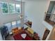 Open concept living room with two-story ceilings and a staircase with iron railings at 5730 Weddington Dr, Cumming, GA 30040