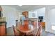 This living room boasts great natural light and hardwood floors at 5730 Weddington Dr, Cumming, GA 30040