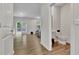 A half bathroom with contemporary fixtures next to an open concept living and kitchen area at 7730 Demeter Dr, Fairburn, GA 30213