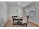 Cozy dining room featuring hardwood floors, ample natural light, and a neutral color palette at 7730 Demeter Dr, Fairburn, GA 30213