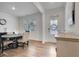 Elegant dining room with hardwood floors, a stylish table set, and modern decor at 7730 Demeter Dr, Fairburn, GA 30213