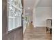 Welcoming entryway showcasing beautiful hardwood floors and a glimpse into the spacious interior at 7730 Demeter Dr, Fairburn, GA 30213