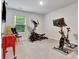 Entertainment room with gym equipment and arcade games at 7730 Demeter Dr, Fairburn, GA 30213