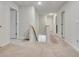 Upstairs hallway featuring neutral walls and carpet at 7730 Demeter Dr, Fairburn, GA 30213