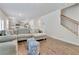 Spacious living room with an open floor plan leading to the kitchen and a staircase at 7730 Demeter Dr, Fairburn, GA 30213