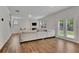 Bright living room with hardwood floors, fireplace, and a large comfortable sectional sofa at 7730 Demeter Dr, Fairburn, GA 30213