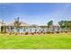 View of community swimming pool with lounge chairs, patio area and black metal fence at 7730 Demeter Dr, Fairburn, GA 30213