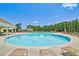 Resort-style swimming pool and deck with lounge chairs offer an inviting outdoor space to relax and enjoy the community at 7730 Demeter Dr, Fairburn, GA 30213