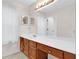 Bathroom showcasing a vanity with a long countertop, a sink, and a large mirror at 991 Lisa Kay Dr, Lawrenceville, GA 30046