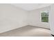 Bedroom featuring carpet and a window view of the trees outside at 991 Lisa Kay Dr, Lawrenceville, GA 30046