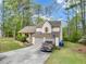 Charming home with a two-car garage, set back on a nicely wooded lot at 991 Lisa Kay Dr, Lawrenceville, GA 30046