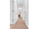 Hallway view leading to a bathroom with a wooden vanity and toilet at 991 Lisa Kay Dr, Lawrenceville, GA 30046