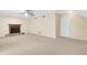 Bright living room with a cozy fireplace and neutral carpet at 991 Lisa Kay Dr, Lawrenceville, GA 30046