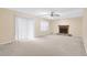 Spacious living room featuring a fireplace and sliding glass door leading to outdoor space at 991 Lisa Kay Dr, Lawrenceville, GA 30046