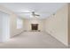 Open living room with a fireplace and a sliding glass door at 991 Lisa Kay Dr, Lawrenceville, GA 30046