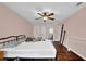 Spacious primary bedroom with wood floors, neutral walls, ceiling fan, and ample natural light at 1315 Arden Sw Dr, Marietta, GA 30008