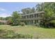 Charming two-story home with a well-manicured lawn and a large tree at 1315 Arden Sw Dr, Marietta, GA 30008
