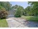 Traditional two-story home with a large front lawn and mature trees at 1315 Arden Sw Dr, Marietta, GA 30008