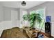 Versatile room with hardwood floors, white wainscoting, and a bright window perfect for various uses at 1315 Arden Sw Dr, Marietta, GA 30008