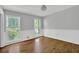 Bright room with wood floors, wainscoting, and two windows providing natural light at 1315 Arden Sw Dr, Marietta, GA 30008