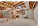 Unfinished basement featuring exposed ceiling and cement walls at 2350 Shore View Nw Way, Suwanee, GA 30024