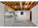 Spacious unfinished basement with exposed ceiling and concrete floor at 2350 Shore View Nw Way, Suwanee, GA 30024