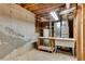 Unfinished basement featuring a sink, water heater, and concrete walls at 2350 Shore View Nw Way, Suwanee, GA 30024