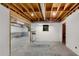 Unfinished basement area with concrete walls and a small window at 2350 Shore View Nw Way, Suwanee, GA 30024