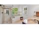 Bright bathroom with double sinks, soaking tub, and walk-in shower with decorative tile and granite counters at 2350 Shore View Nw Way, Suwanee, GA 30024