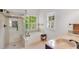 Bright bathroom with a shower, soaking tub, double sink, vanity, and a view of the outdoors at 2350 Shore View Nw Way, Suwanee, GA 30024