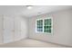 Bedroom with natural light, carpet and neutral walls at 2350 Shore View Nw Way, Suwanee, GA 30024
